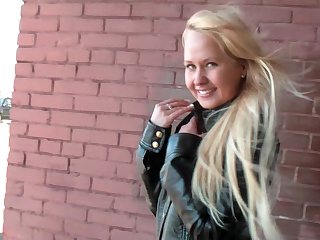 Flashing teen in skirt and leather jacket